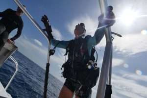 Diver climbing back on board the boat
