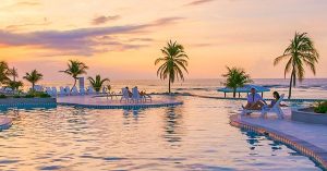 Sunset over the infinity pool at Cayman Brac Beach Resort